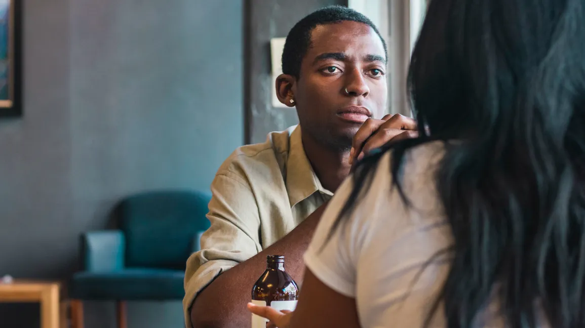 Two-people-having-discussion-in-cafe-header