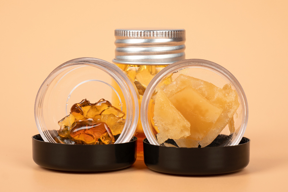 bottles with different varieties of cannabis golden wax extract