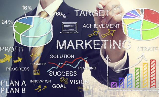 Businessman drawing marketing concepts