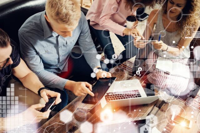 Global Strategy Connection Data Virtual Icon Innovation Graph Interface.Coworkers Making Great Online Business Solution.Trading Team Discussion Corporate Work Concept Studio.Electronic Gadget Hand.