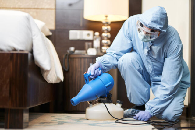 male-disinfector-protective-clothes-spraying-disinfectants